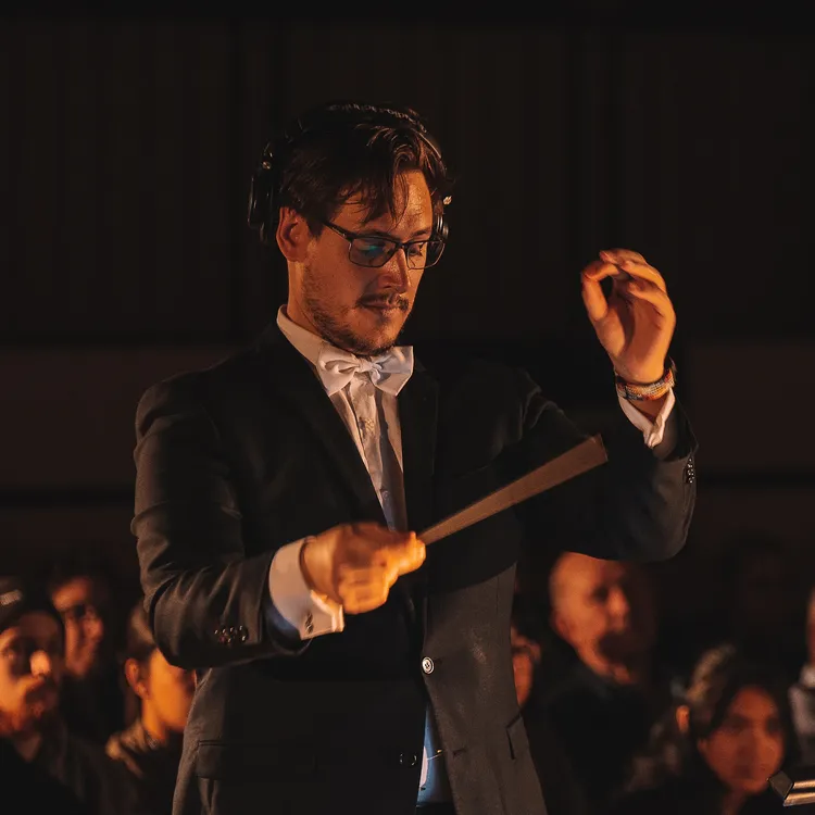 A photo of Nathan conducting the Woodville Concert Band